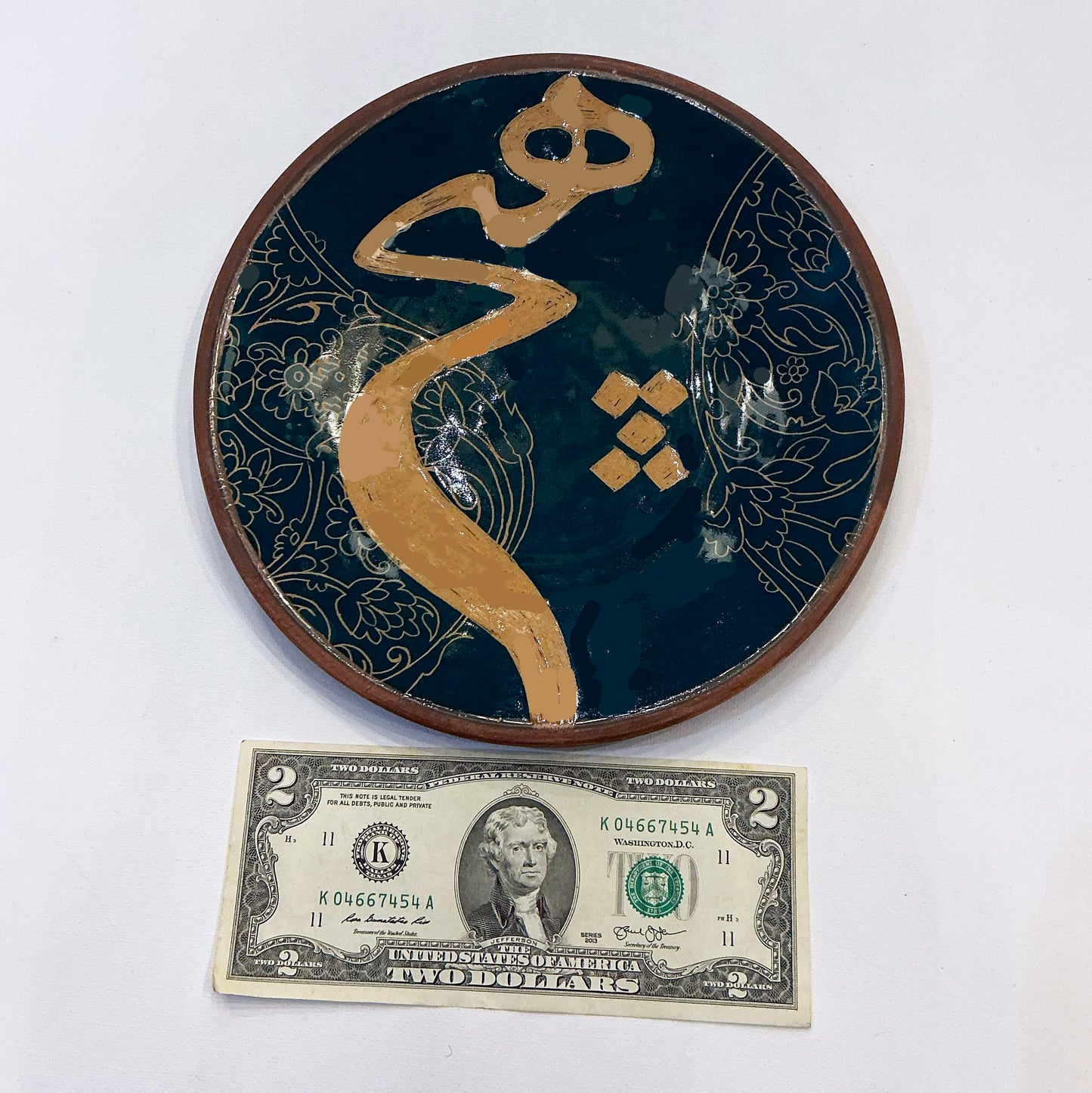 A Round Ceramic with a Persian Calligraphy of the Word " Nothing" (Hich)